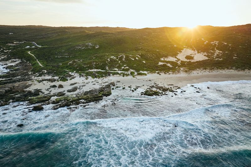 Drone view of surf breaking at sunrise, Gas Bay, Margaret River