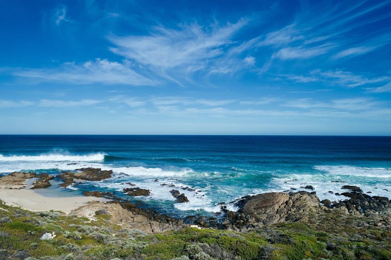 Reef, heath and open ocean under blue sky, Honeycombs, Yallingup