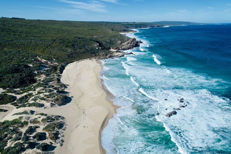 Aerial view of a curving beach and surf, Honeycombs, Yallingup