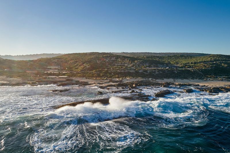 Drone view of surf where river meets sea, Margaret River mouth