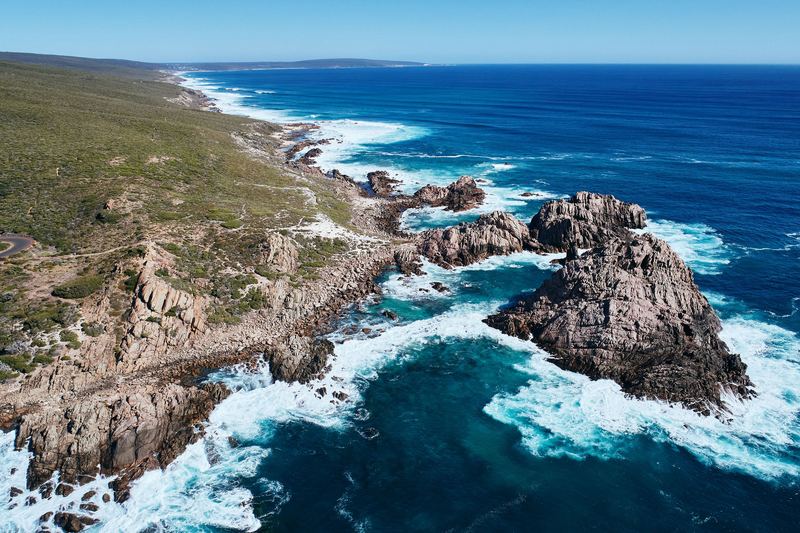 Granite islands in deep blue water, Sugarloaf Rock, Cape Naturaliste